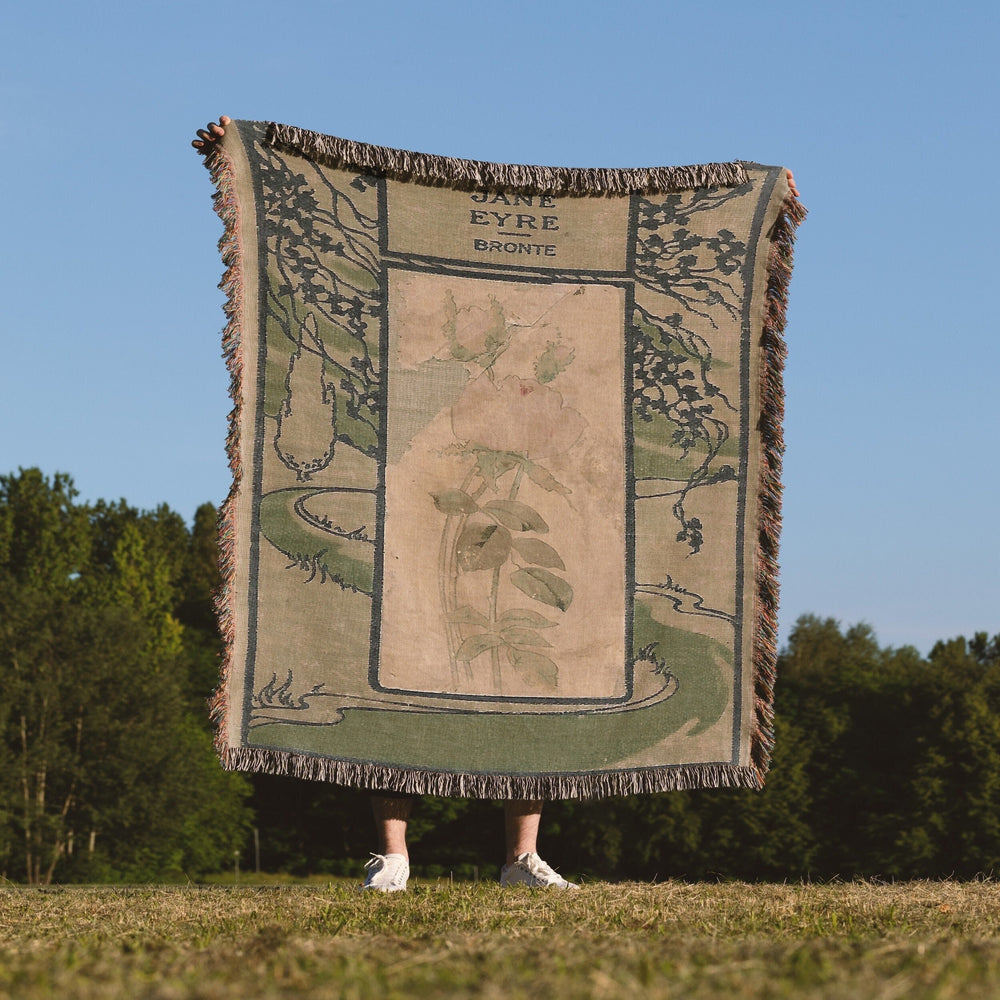 Jane Eyre woven throw blanket showing the vintage book cover design