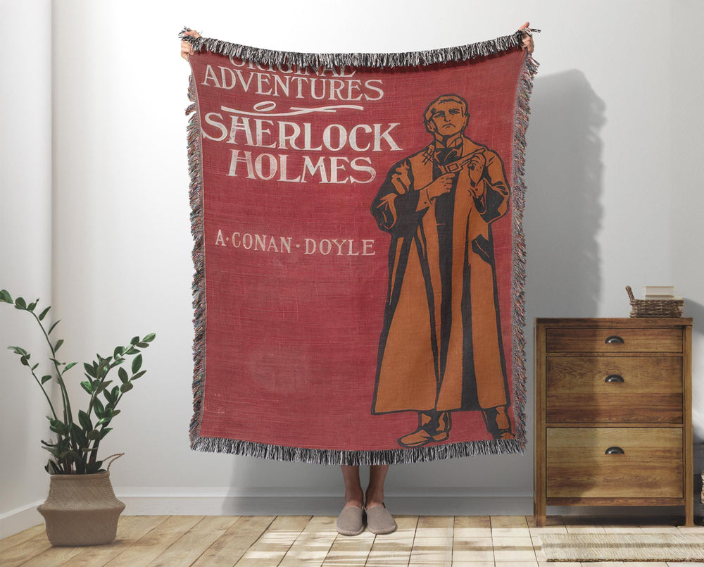 Sherlock Holmes woven throw blanket showing the vintage red Adventures book cover