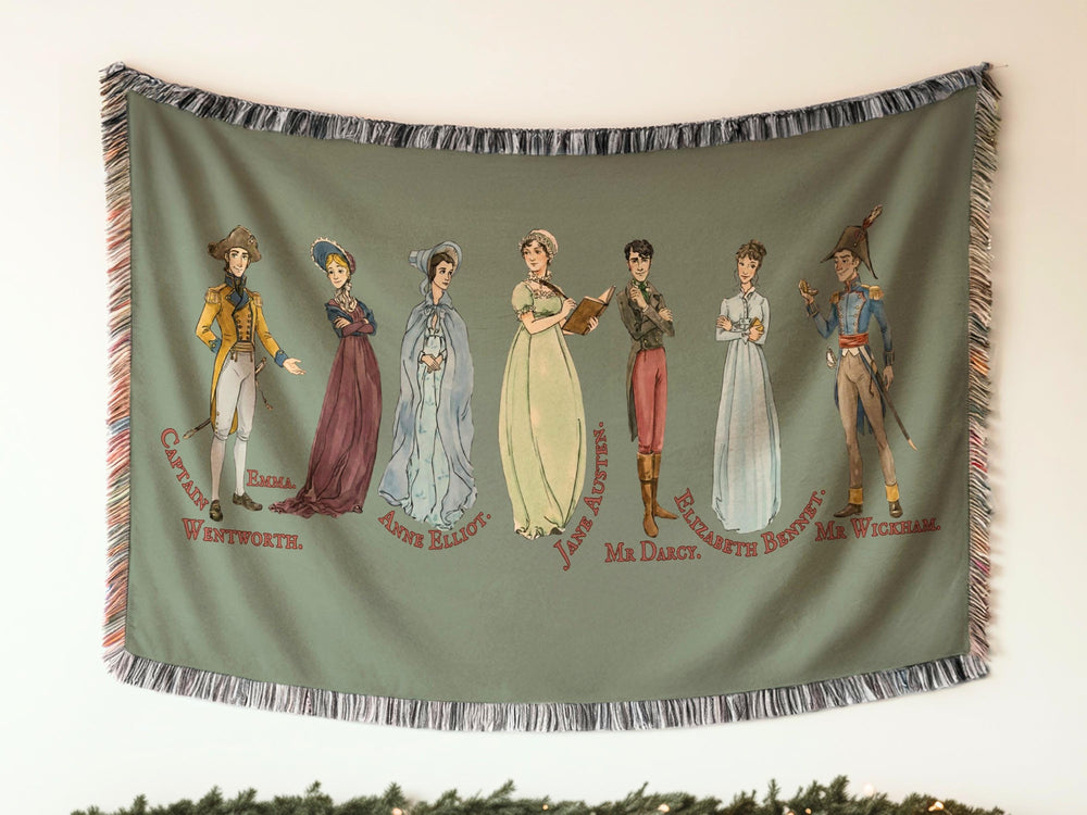 Jane Austen woven throw blanket with illustrated characters including Mr. Darcy, Elizabeth Bennet, Emma, and Captain Wentworth