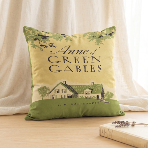 Anne of Green Gables faux suede throw pillow cover showing the vintage book cover with the green gabled farmhouse, a gift for L.M. Montgomery readers