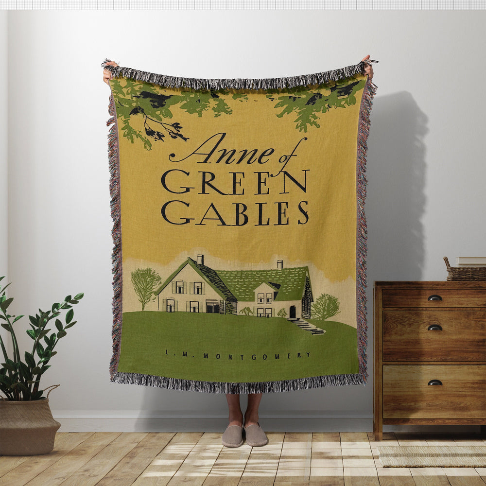 Anne of Green Gables woven throw blanket showing the vintage book cover with the green gabled house