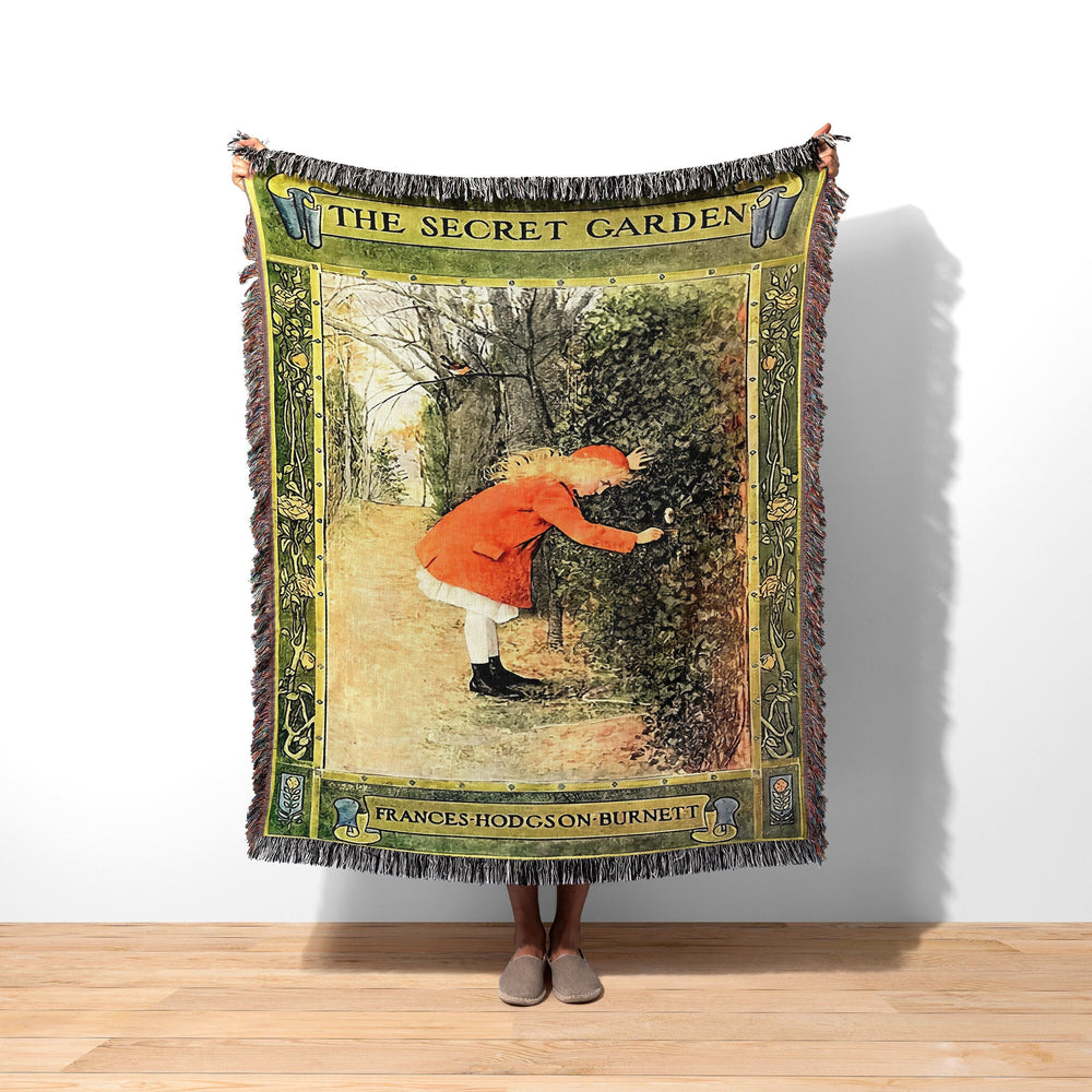 The Secret Garden woven throw blanket showing the vintage cover with Mary finding the hidden door