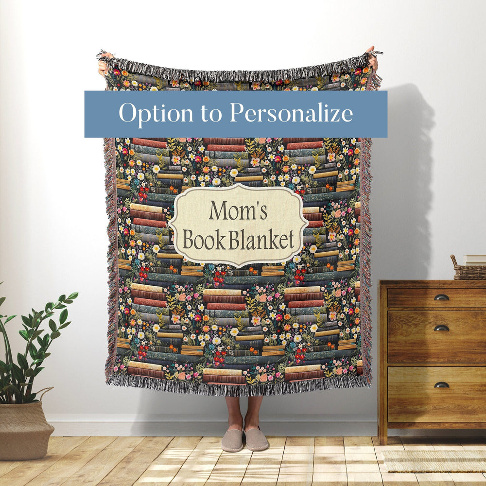 Personalized book lover woven throw blanket with stacked books, wildflowers, and a custom name label