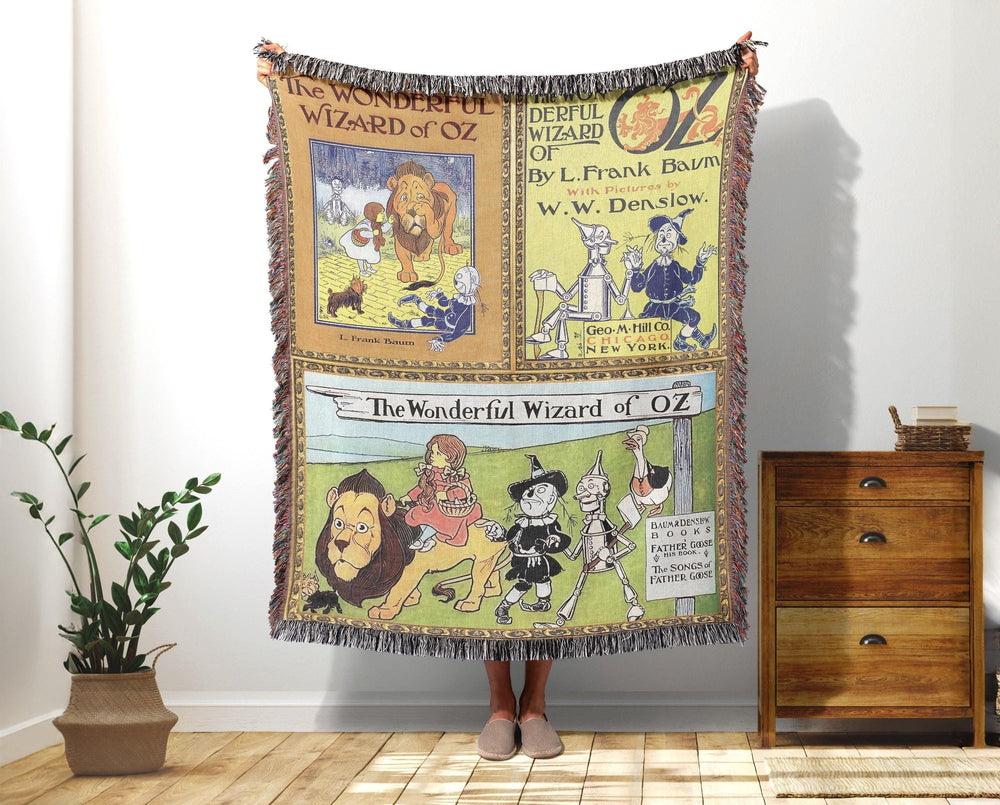 Wizard of Oz woven throw blanket showing three vintage Wonderful Wizard of Oz book covers