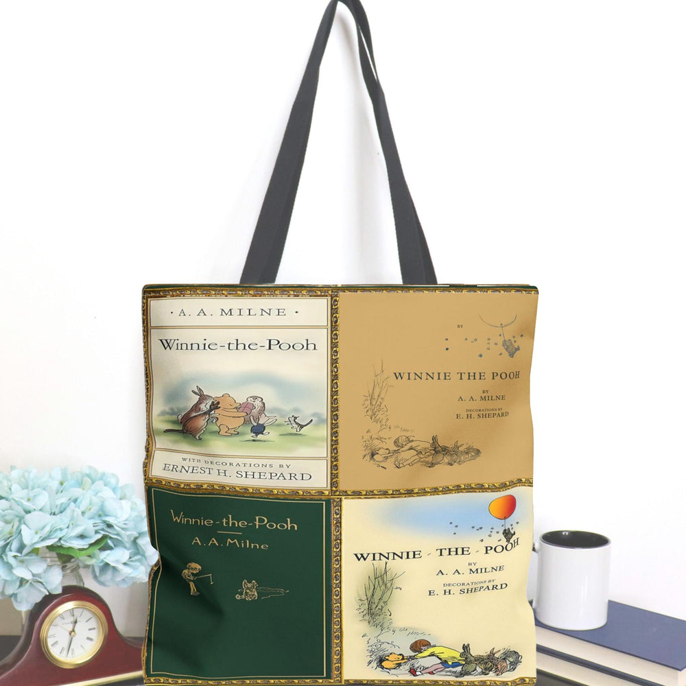Winnie the Pooh tote bag with four classic book cover designs decorated by Ernest H. Shepard