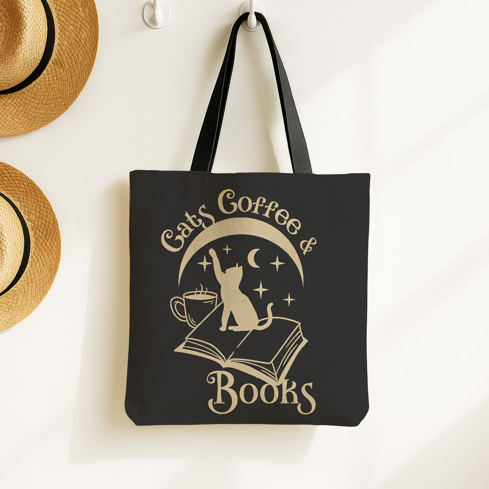 Cats coffee and books black tote bag with a cat on an open book reaching for stars under a crescent moon