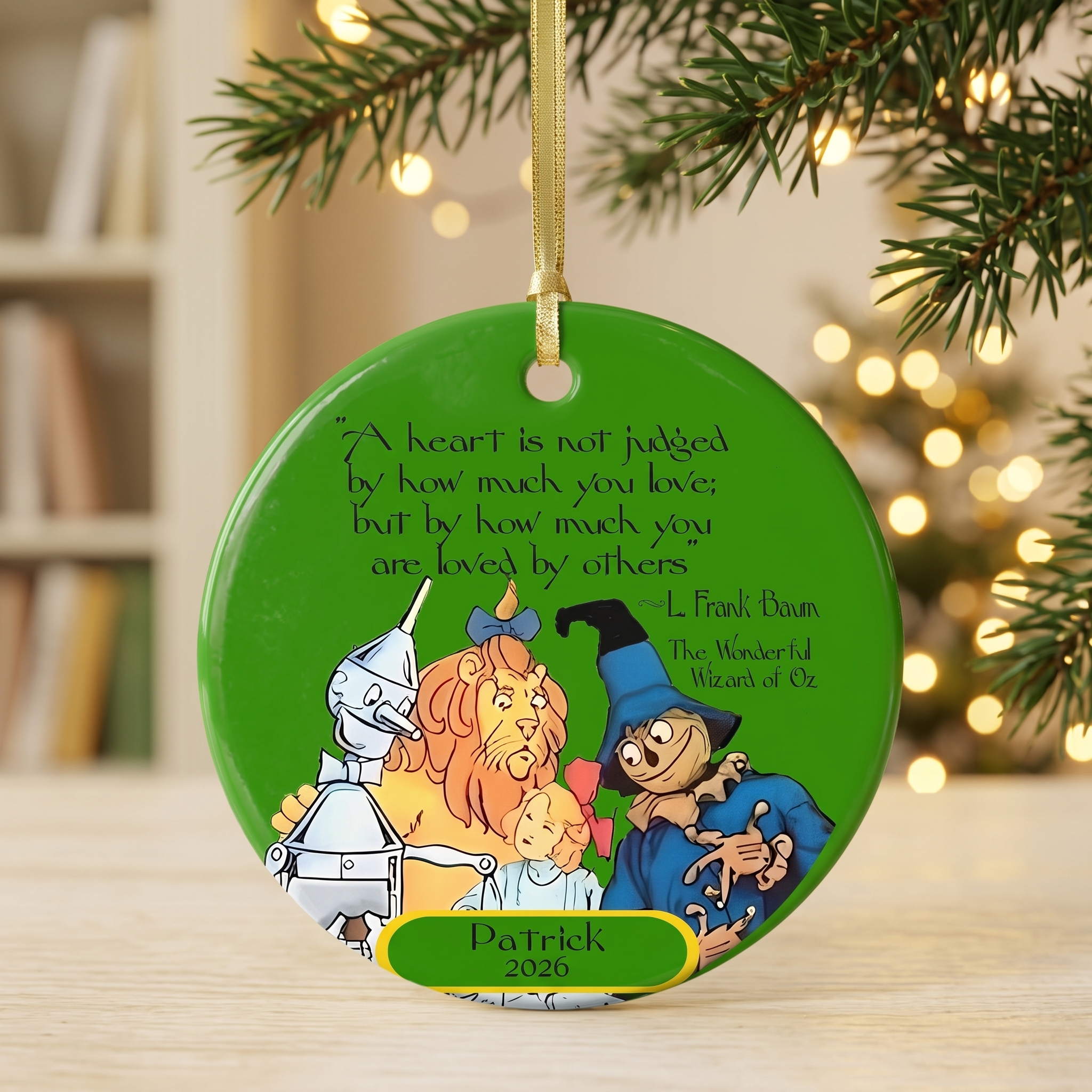 Personalized Wizard of Oz ceramic Christmas ornament with a Tin Man heart quote by L. Frank Baum, front and back.